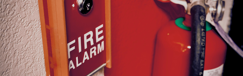 Close up of fire alarm and extinguisher