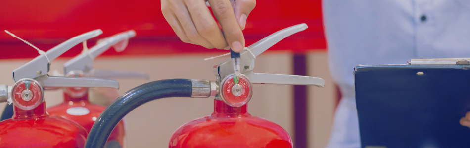 Clipboard with a fire extinguisher in the foreground