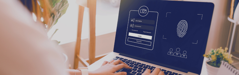 person looking at laptop login screen