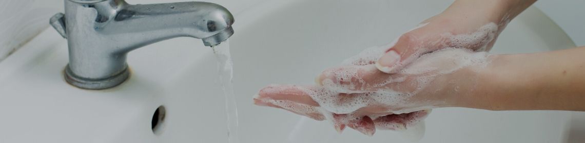 washing hands under tap